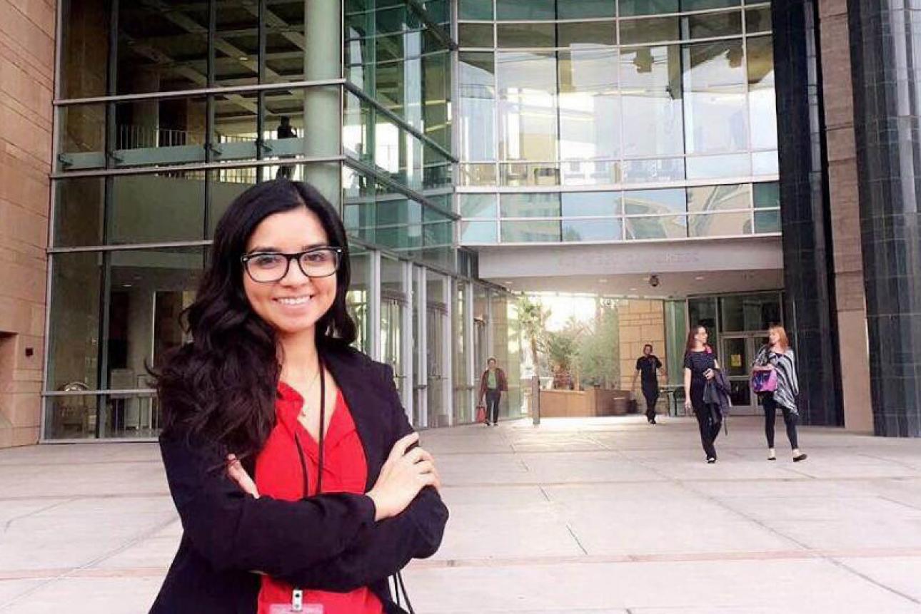 Student intern standing in front of government building